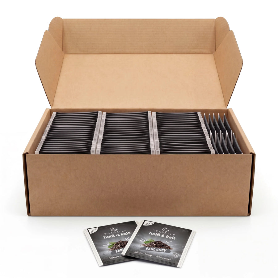 Scatola di bustine monodose TEABALLS Earl Grey aperta con bustine confezionate singolarmente