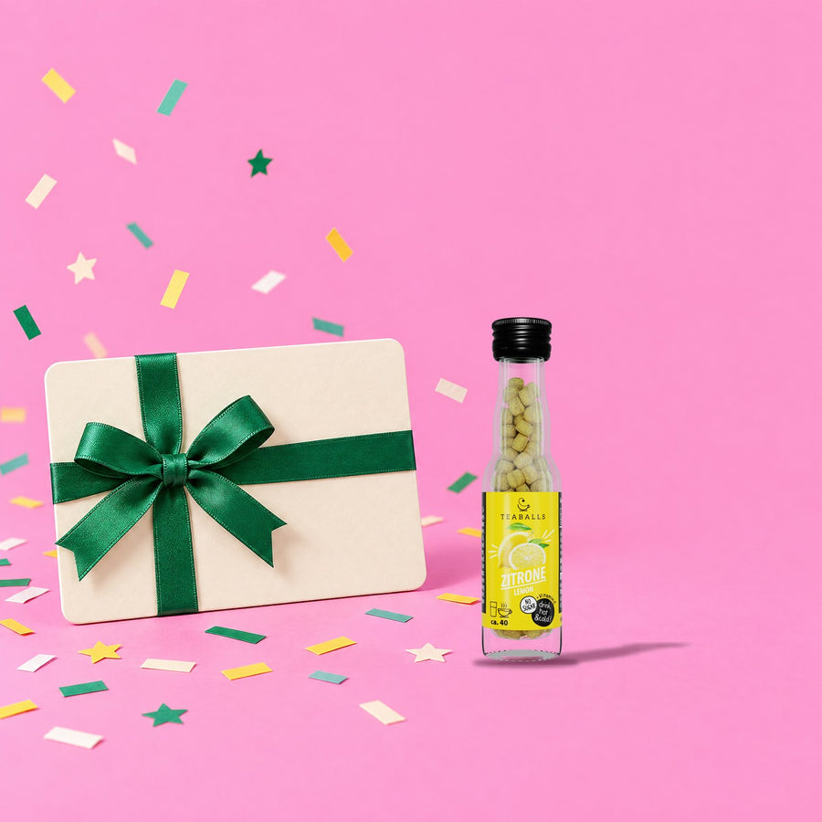 Buono regalo TEABALLS: carta regalo con nastro verde e bottiglia al limone
